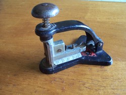 His desk is decorated with ancient staplers
