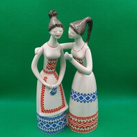 Figurine of J. Starling in a raven house gossiping girls