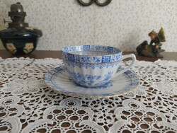 Blue patterned cup with coaster