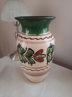 A large vase of folk ceramics