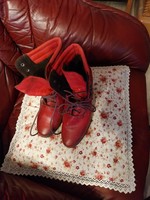 Red, used, high-heeled lace-up leather shoes