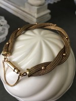 Special, braided, antique bracelet decorated with small gold pearls