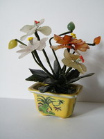 Bouquet of flowers made of minerals in ikebana porcelain holder