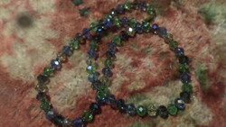 52 Cm, bluish-greenish-smoky colored necklace made of faceted crystal beads.