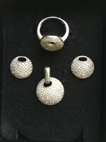 Silver jewelry set richly decorated with tiny zirconia stones