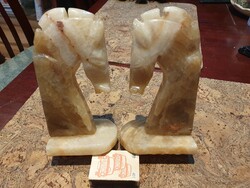 A pair of polished onyx horse-shaped stone bookends are perfect