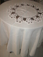 Beautiful, hand-crocheted, cream-colored round tablecloth with flower inserts