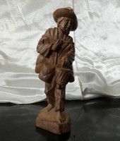 Old Chinese wooden figure of a peasant returning from rice fields