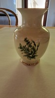 Raven's house vase with green flowers