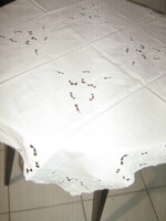 Beautiful elegant white tablecloth with rosette flowers