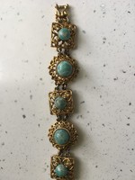A strikingly beautiful vintage bracelet decorated with turquoise stones