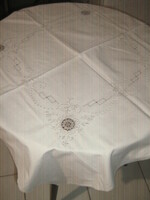 Wonderful beige tablecloth with crocheted floral pattern insert