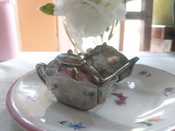Vintage silver-plated metal tea filter holder stand, shaped like a teapot