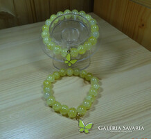 Jade mineral bracelet made of 10 mm pearls. Fire enamel decorated with a yellow butterfly.