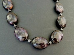 Czaroit mineral necklace with large eyes