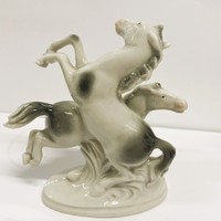 A rare Fasold & Stauch porcelain pair of horses