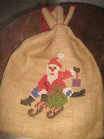A charming woven hand-embroidered red-lined Santa bag with cross stitches