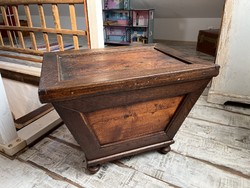 Antique chest in the shape of an old wagon box.