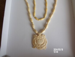 Bone necklace with rose pendant