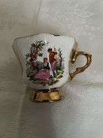 Dreamy antique earthenware cup with golden interior,