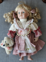 Doll with porcelain head and limbs