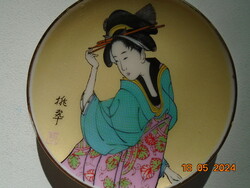 Miniature geisha portrait on a bowl with hand markings