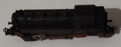 Toy locomotive with wagons and rails