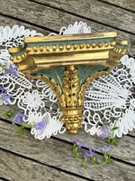 Old wall bracket made of painted wood decorated with gilded acanthus leaves