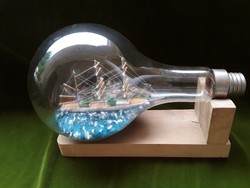 A ship built into a giant light bulb, patience glass