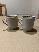 Pair of old gilded mugs
