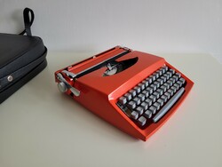 Old retro small red pocket typewriter mid century typewriter