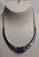 Nice condition silver-colored stainless steel necklace with a patterned fire enamel pendant
