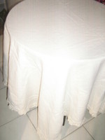 Beautiful antique cream yellow woven tablecloth with crocheted edges