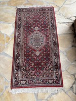 Old Iranian? A hand-knotted carpet or even a wall protector ideal as a wall protector