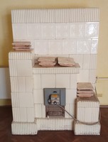 Old white ceramic stove from Besztercs from the 1920s