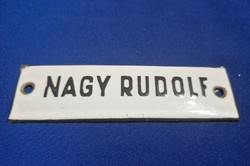 A small enamel plaque with the name Rudolph Nagy