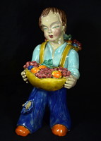 H. Mária Ráhmer is a putton boy harvesting fruit
