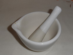 White porcelain mortar and pestle and mortar