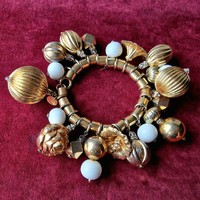 1980s Velentino gold tone with a lot pendants runway bracelet