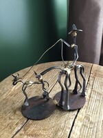 Cowboy statue made from old dale warren horseshoe nails