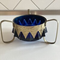 Blue glass centerpiece, served in a metal holder