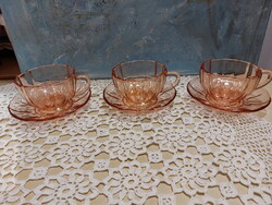Salmon-colored glass tea cups and sets