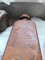 Cervantes-themed leather-coated glass