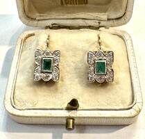 Women's earrings pair with diamonds and emeralds