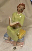 H. Mária Rahmer: Girl sitting on books