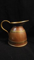 Red and brass old pouring spout