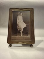 Art deco style metal picture frame with a picture of a lady