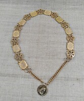 Retro gold-colored metal waist belt