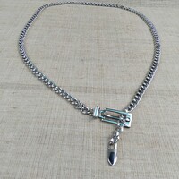 RETRO EZÜST SZÍNŰ FÉM MÁRKAJELZETT SORSZÁMOZOTT DERÉK ÖV