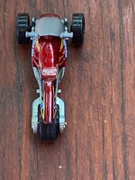 Hot Wheels versenyautó. Nagyon szép teljesen  új állapotban. 6,5 cm Bordó színű.